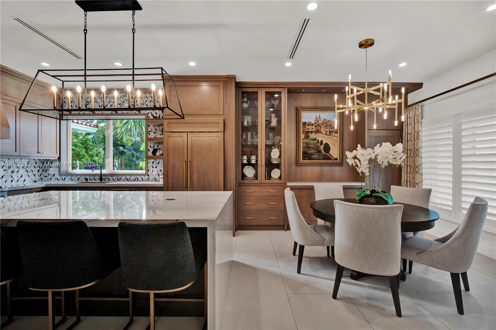 426 Hardee Road Coral Gables, FL 33146 - Photo 2 of 52 a dining room with furniture a chandelier and window
