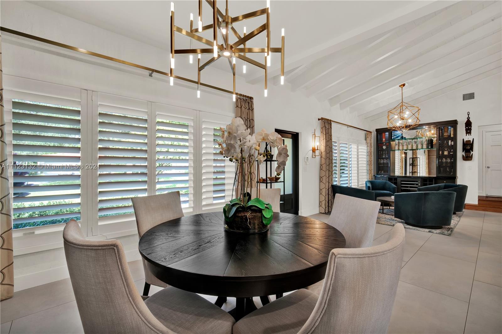 426 Hardee Road Coral Gables, FL 33146 - Photo 13 of 52 a view of a dining room with furniture and wooden floor