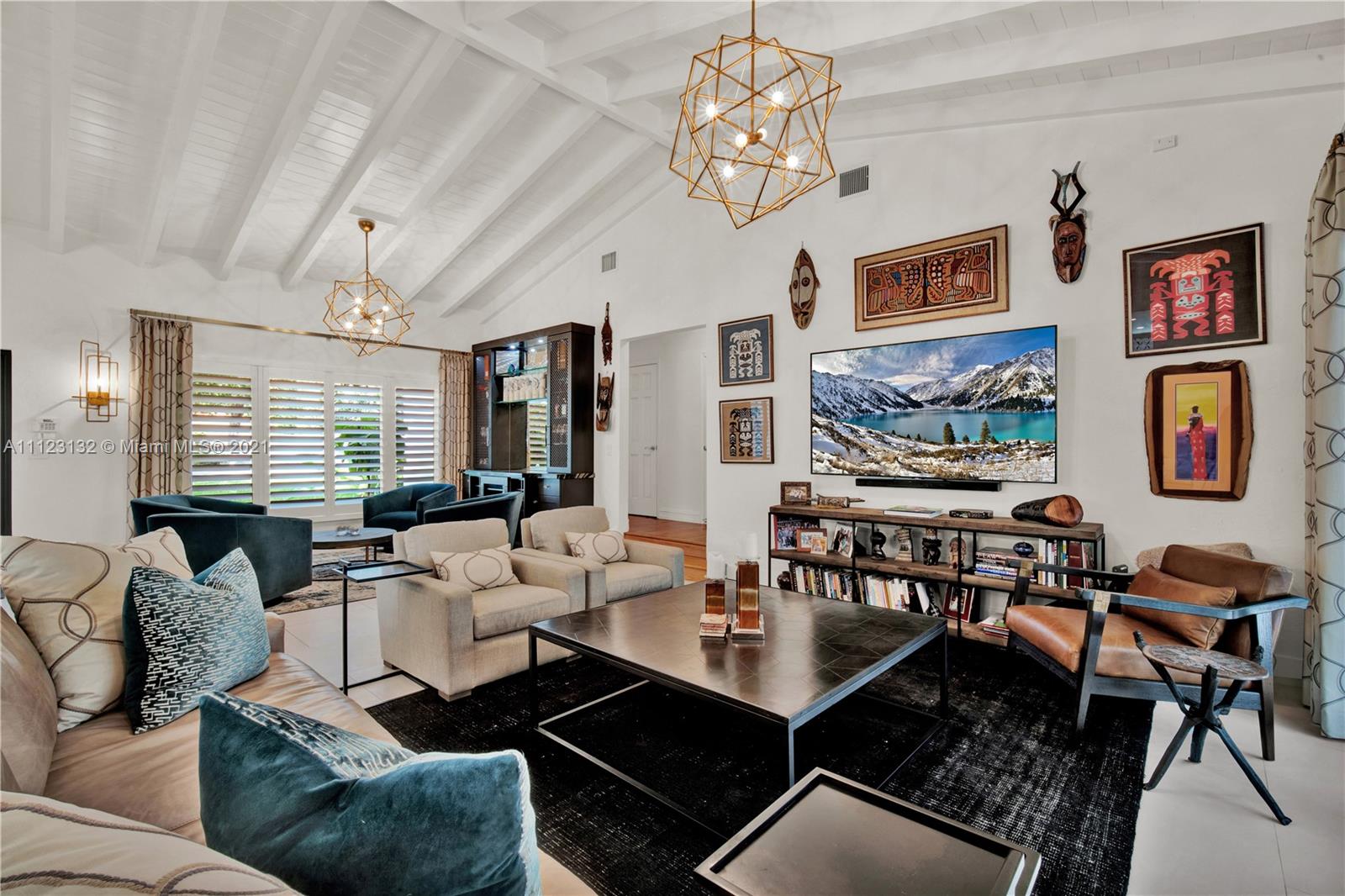 426 Hardee Road Coral Gables, FL 33146 - Photo 14 of 52 a living room with fireplace furniture and a flat screen tv