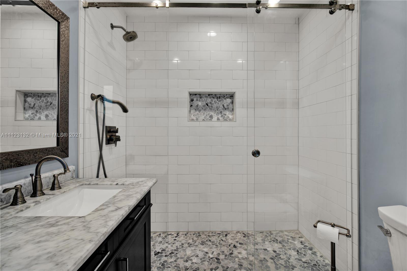 426 Hardee Road Coral Gables, FL 33146 - Photo 15 of 52 a bathroom with a granite countertop sink a toilet and shower