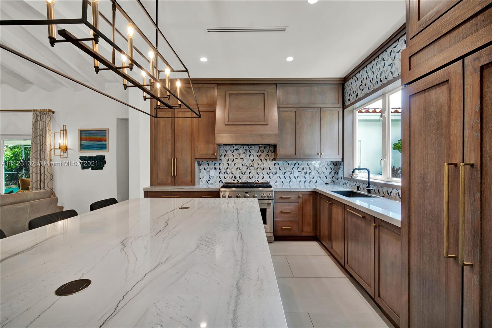 426 Hardee Road Coral Gables, FL 33146 - Photo 3 of 52 a large white kitchen with a large window