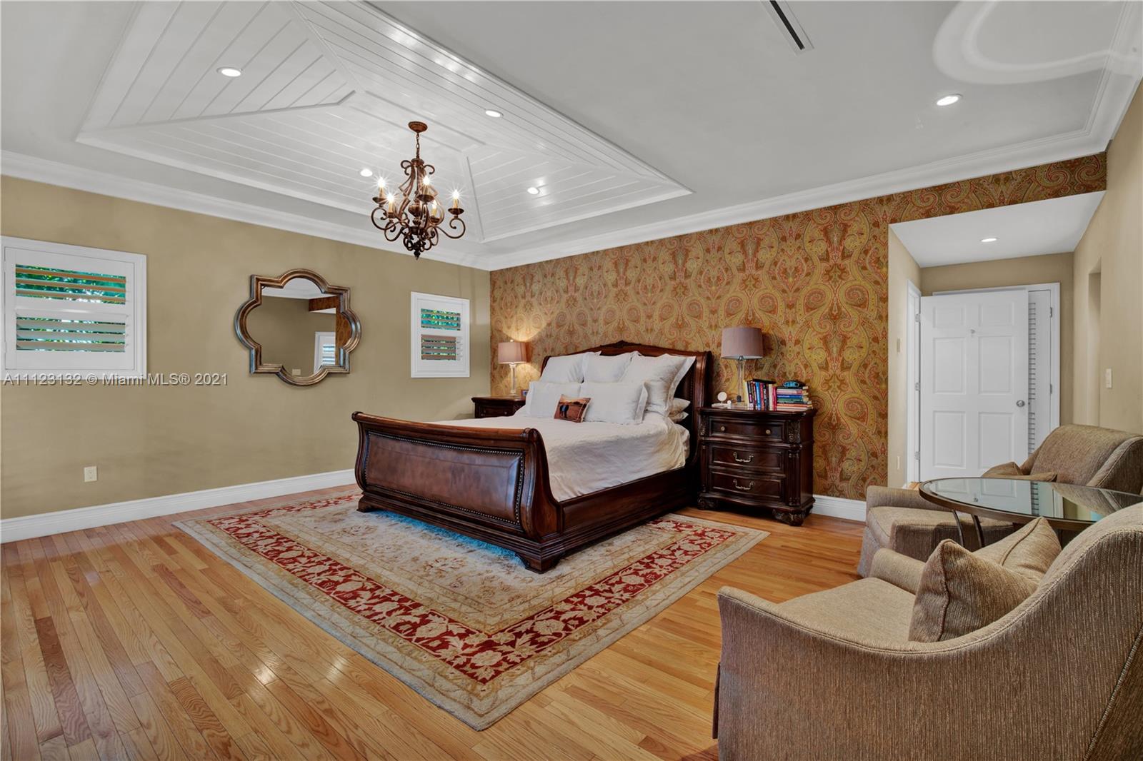 426 Hardee Road Coral Gables, FL 33146 - Photo 21 of 52 a bedroom with furniture and a chandelier