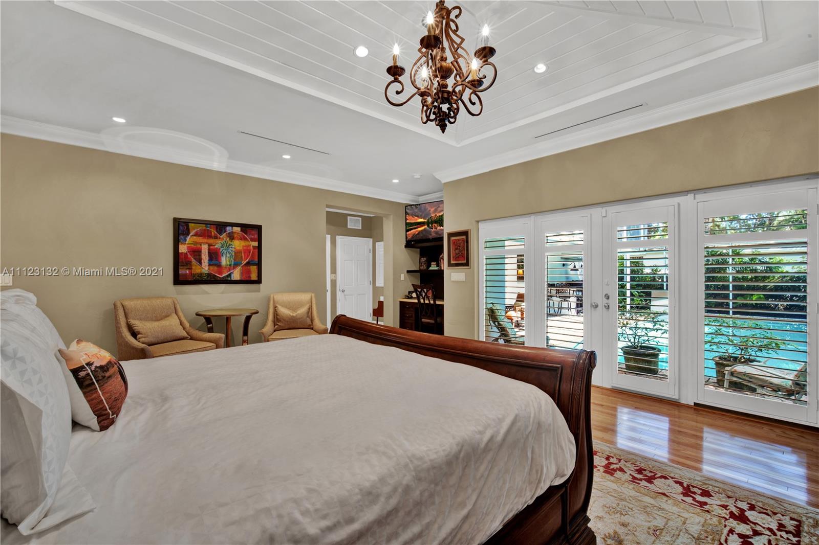 426 Hardee Road Coral Gables, FL 33146 - Photo 22 of 52 a bedroom with a large bed and a large window