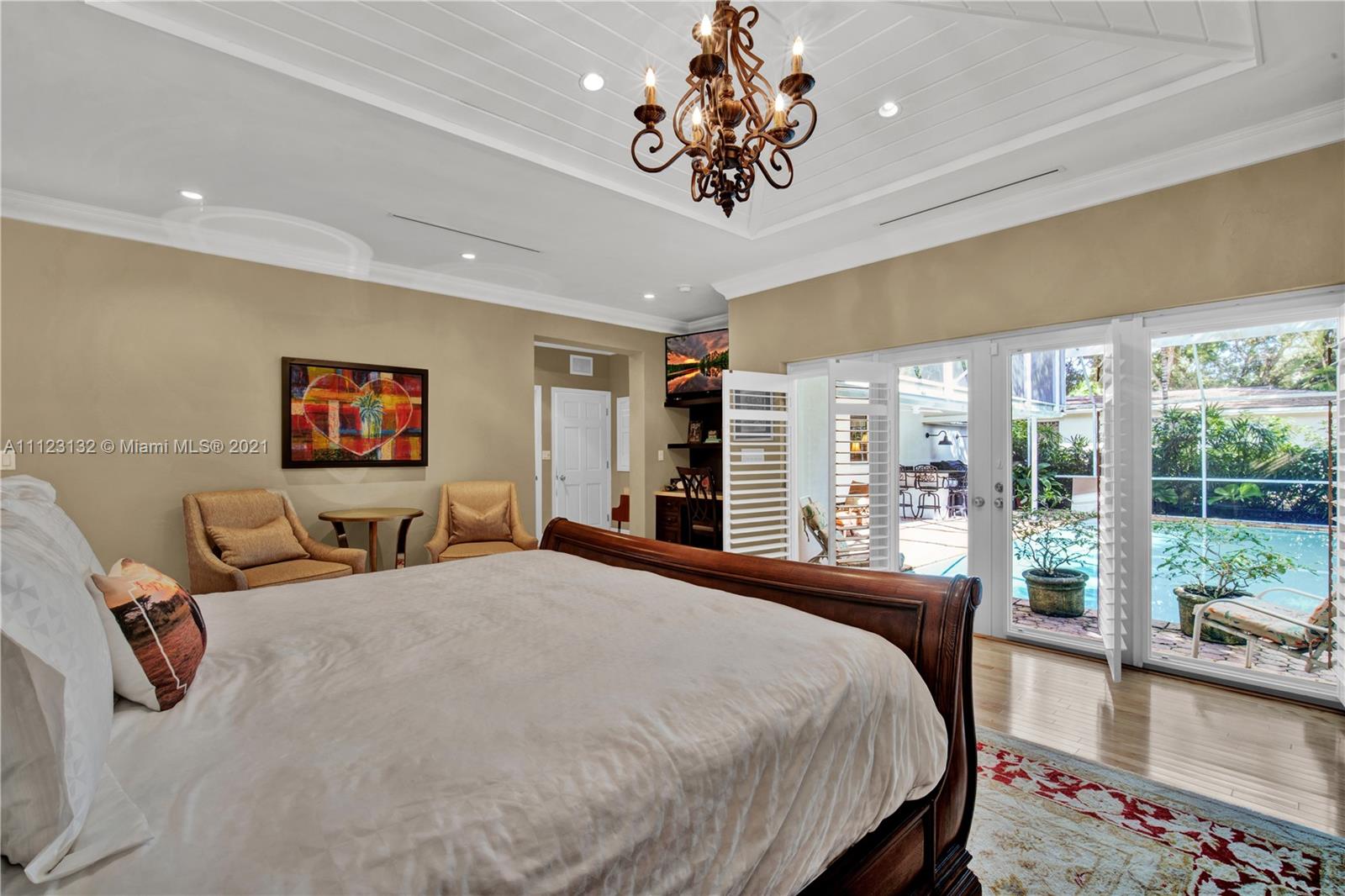 426 Hardee Road Coral Gables, FL 33146 - Photo 23 of 52 a bedroom with a large bed and a large window