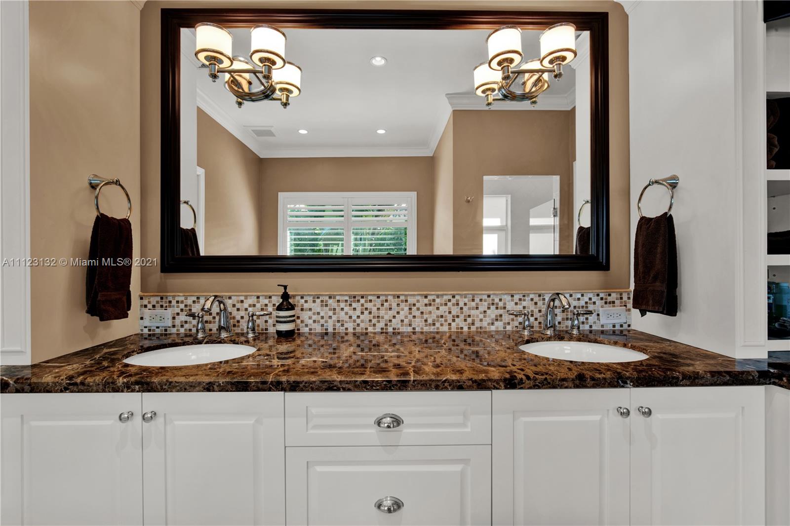 426 Hardee Road Coral Gables, FL 33146 - Photo 29 of 52 a bathroom with a sink and a mirror