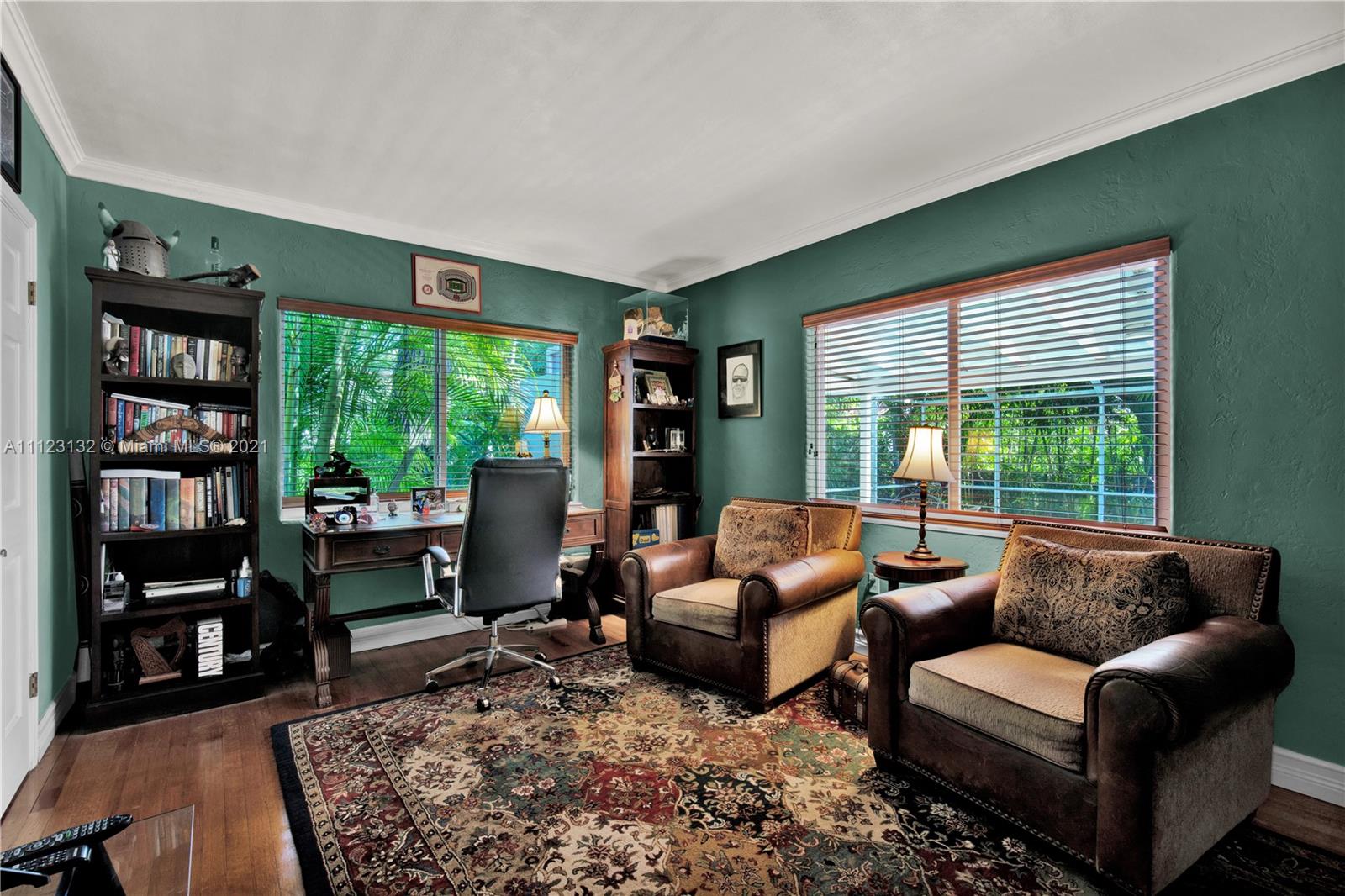 426 Hardee Road Coral Gables, FL 33146 - Photo 32 of 52 a living room with furniture and a large window with bookshelf