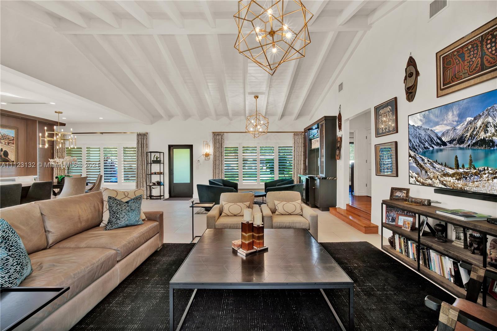 426 Hardee Road Coral Gables, FL 33146 - Photo 37 of 52 a living room with furniture a chandelier a rug and a chandelier