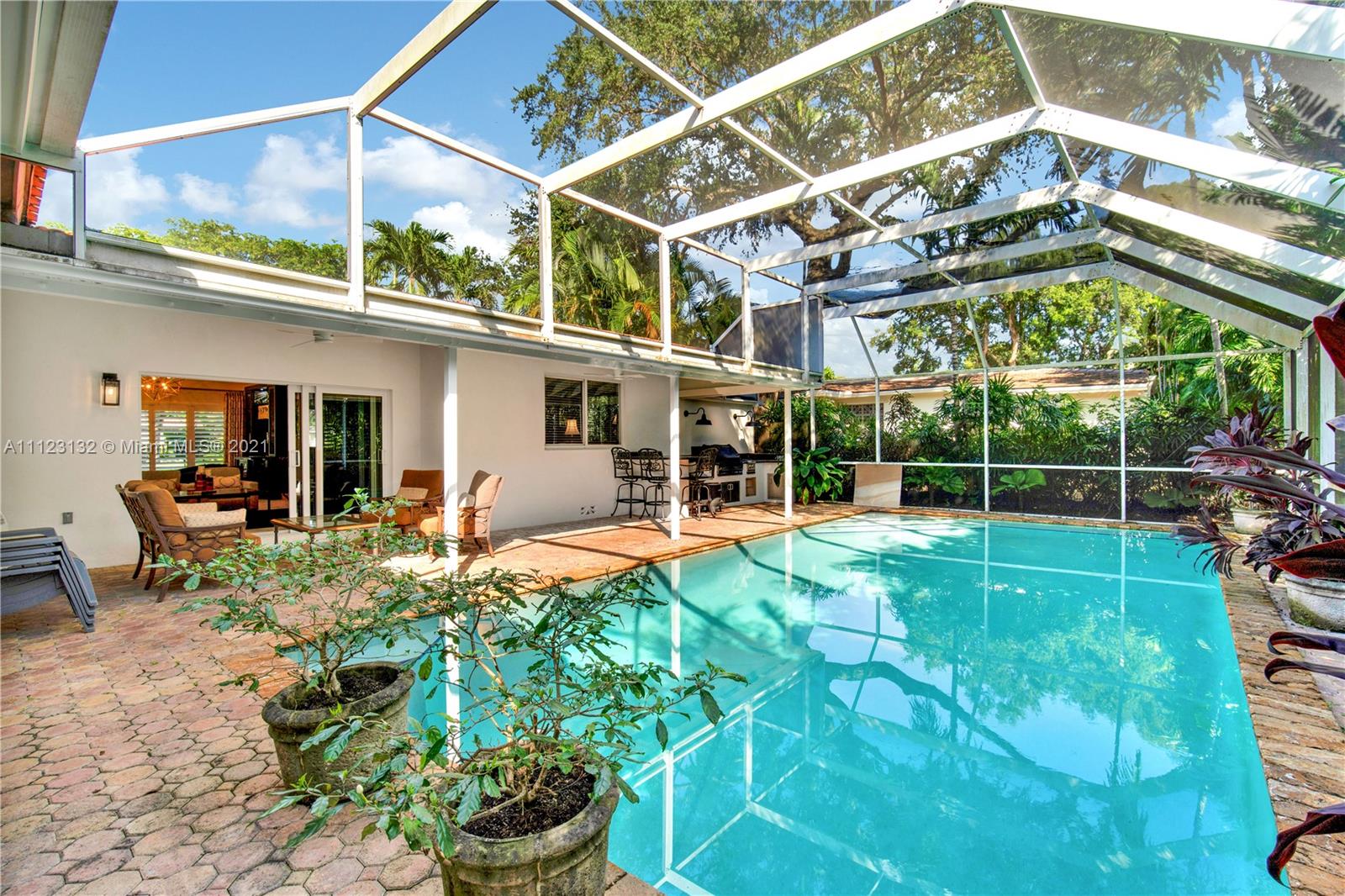 426 Hardee Road Coral Gables, FL 33146 - Photo 40 of 52 a view of a house with a backyard and a porch