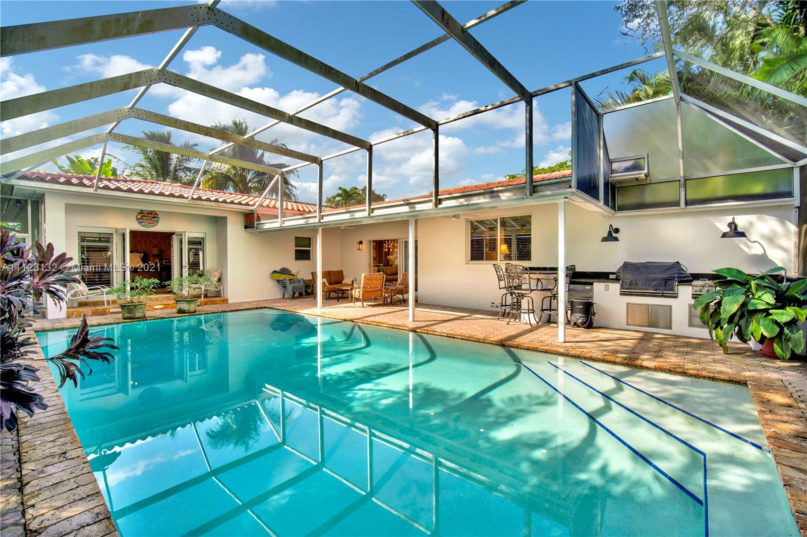 426 Hardee Road Coral Gables, FL 33146 - Photo 43 of 52 a view of a swimming pool with a patio