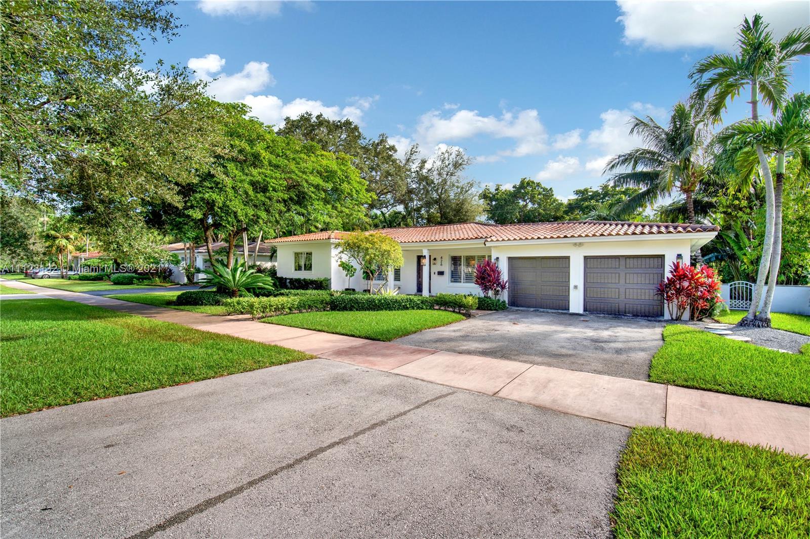 426 Hardee Road Coral Gables, FL 33146 - Photo 49 of 52 a front view of house with yard and green space