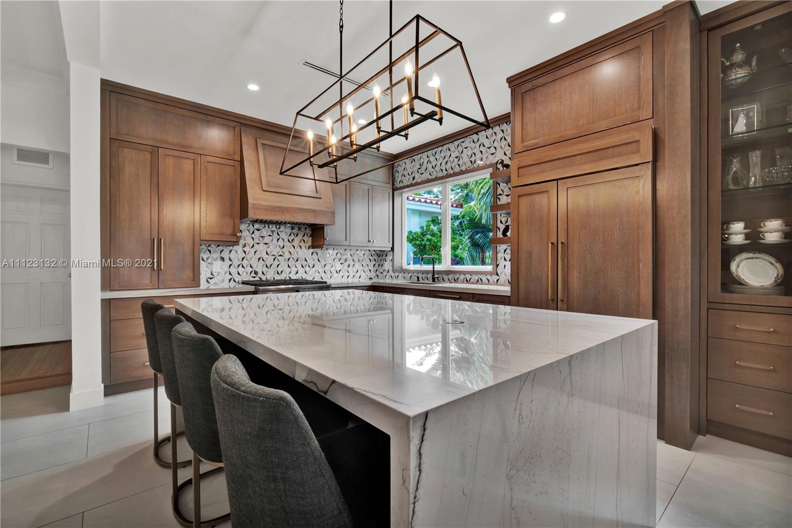 426 Hardee Road Coral Gables, FL 33146 - Photo 6 of 52 a kitchen with stainless steel appliances granite countertop a sink a refrigerator and window