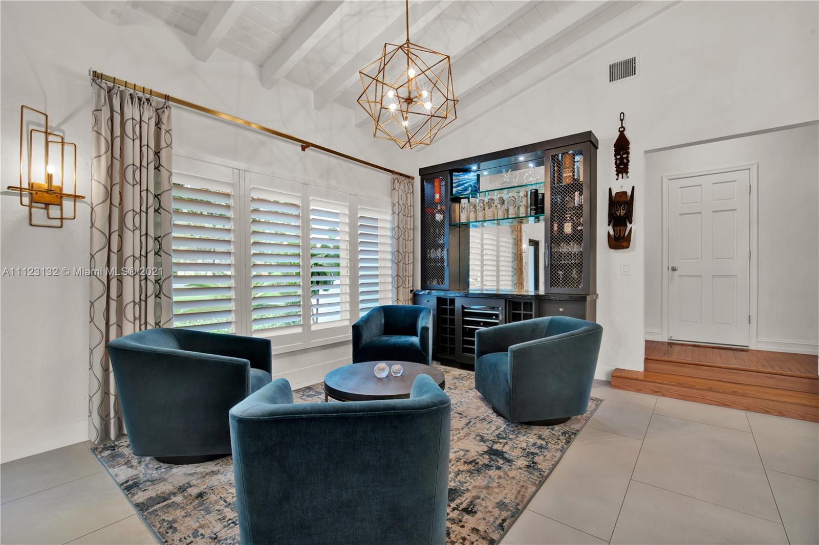 426 Hardee Road Coral Gables, FL 33146 - Photo 9 of 52 a living room with furniture and a chandelier