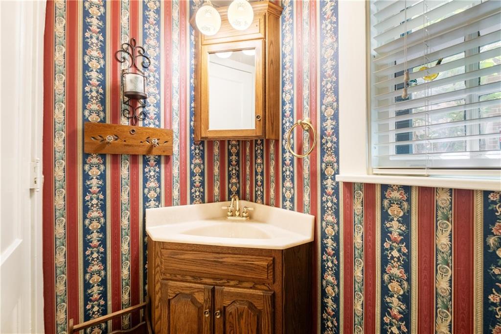 4375 Schenley Farms Terrace Pittsburgh, PA 15213 - Photo 13 of 44 a bathroom with a sink a mirror and next to a window