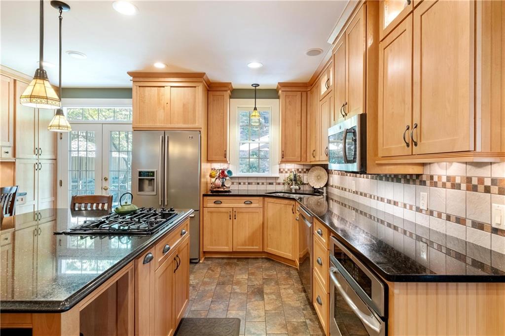 4375 Schenley Farms Terrace Pittsburgh, PA 15213 - Photo 15 of 44 a kitchen with stainless steel appliances granite countertop a sink and a refrigerator