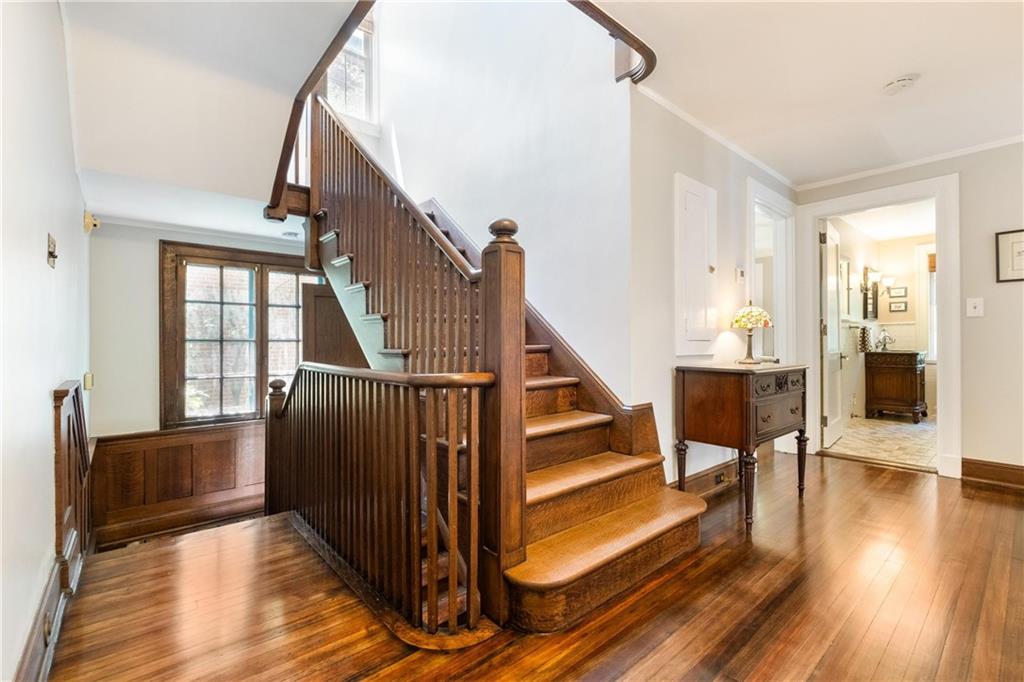 4375 Schenley Farms Terrace Pittsburgh, PA 15213 - Photo 19 of 44 a view of a hallway with wooden floor and staircase