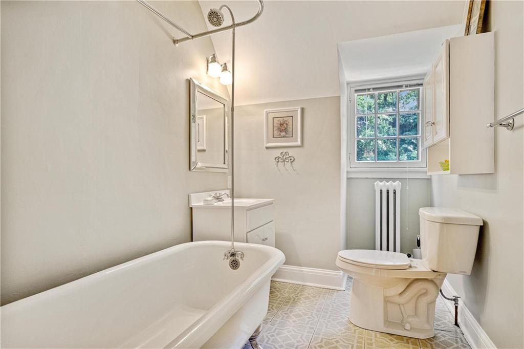 4375 Schenley Farms Terrace Pittsburgh, PA 15213 - Photo 34 of 44 a bathroom with a tub a toilet a sink and a window