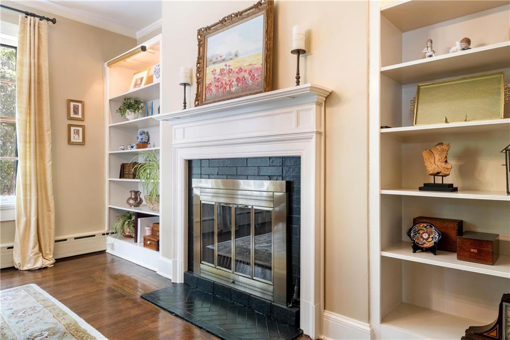 4375 Schenley Farms Terrace Pittsburgh, PA 15213 - Photo 9 of 44 a living room with a fireplace and a book shelf