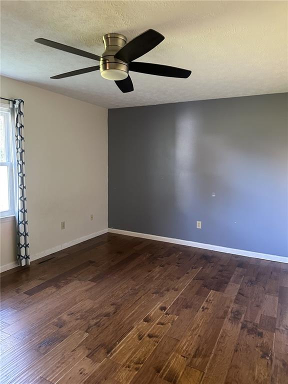 27 Carriage Trace Southeast Cartersville, GA 30121 - Photo 23 of 26 an empty room with wooden floor