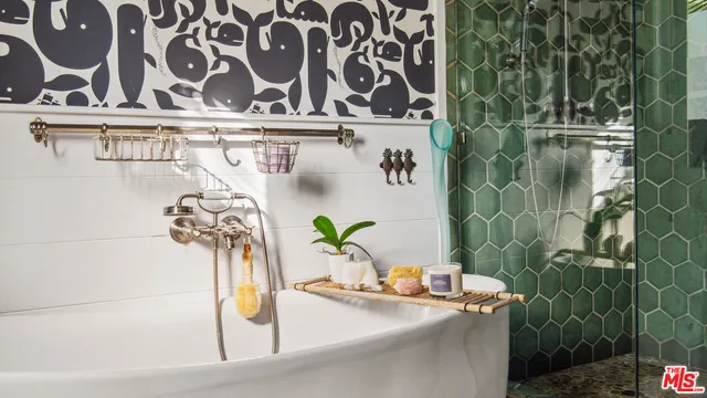 a view of a patio with table and chairs potted plants and large tree