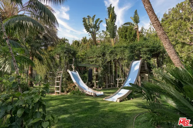 a view of swimming pool with outdoor seating and yard