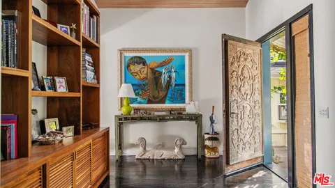 a view of a livingroom with furniture window and entryway