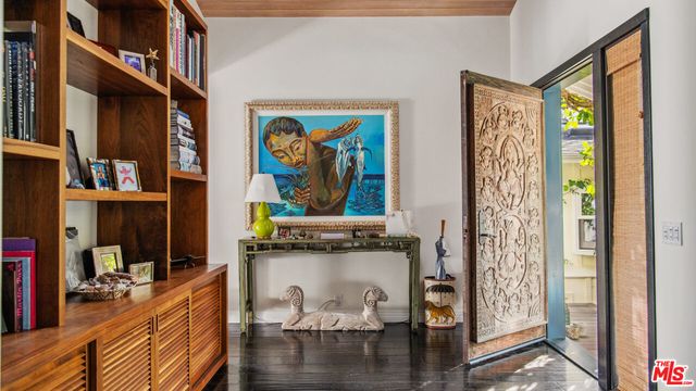 a view of a livingroom with furniture window and entryway