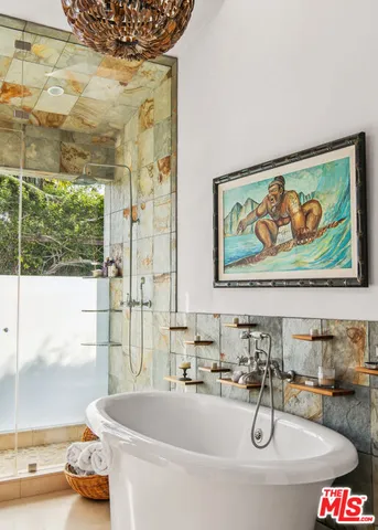 a bath tub sitting next to a bathroom