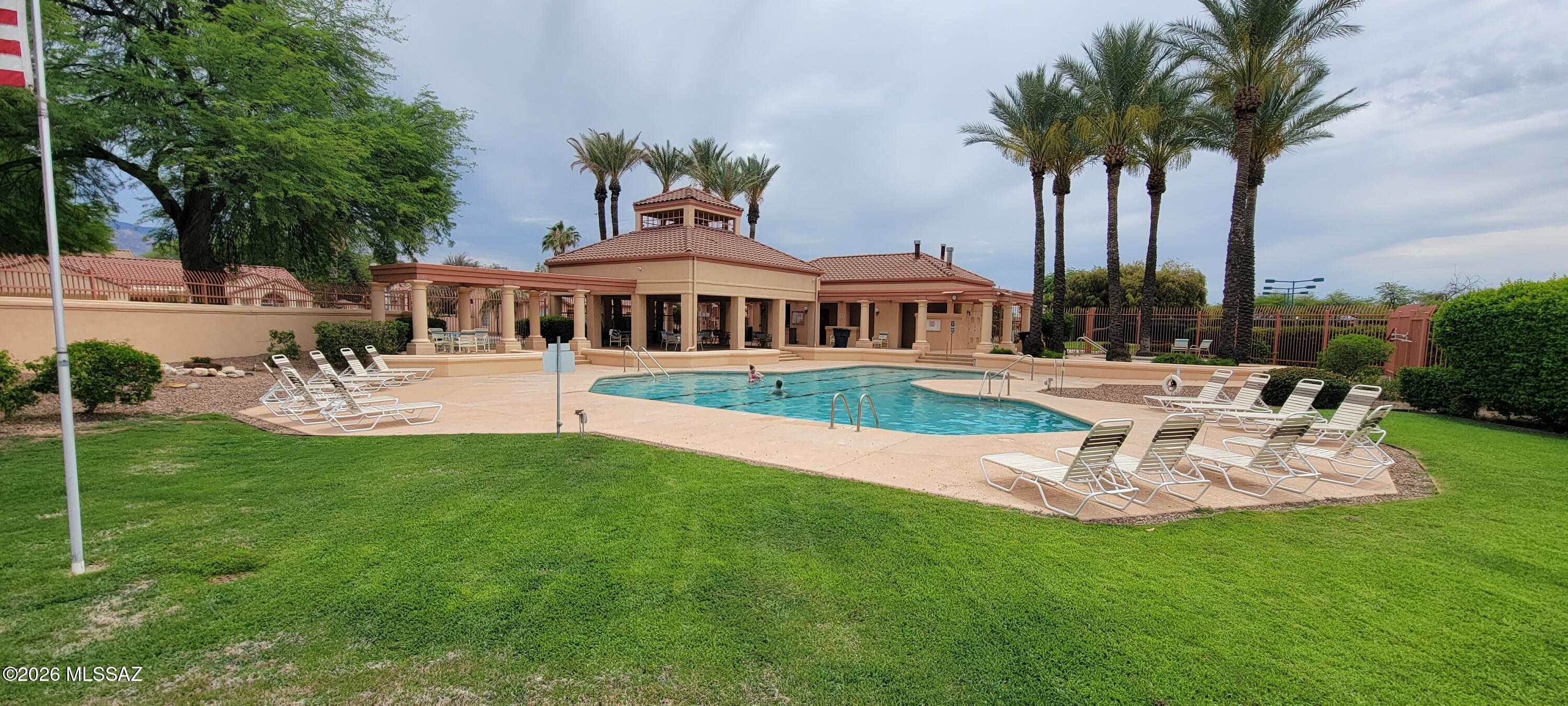 3130 West Star Ranch Trail Tucson, AZ 85742 - Photo 42 of 44 a view of a house with patio and a garden