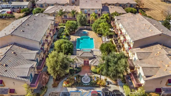 an aerial view of multiple houses with yard