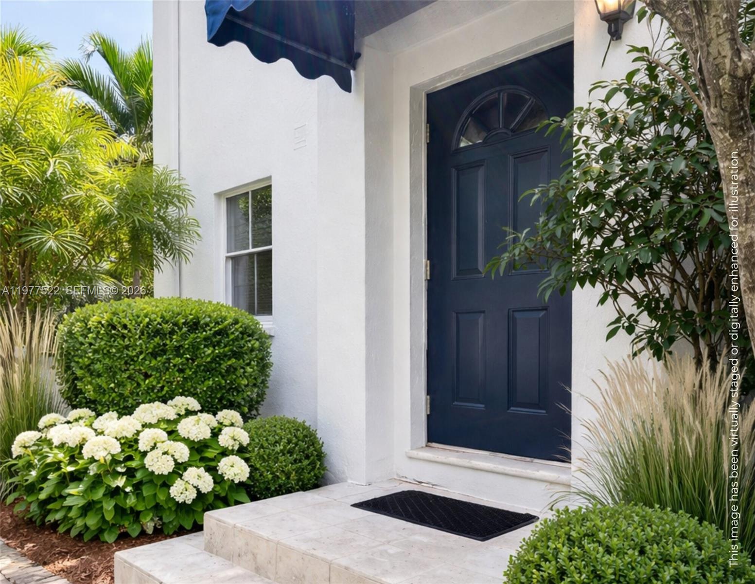 2976 Bird Avenue, Unit 18 Miami, FL 33133 - Photo 1 of 11 a couple of flowers in front of a door