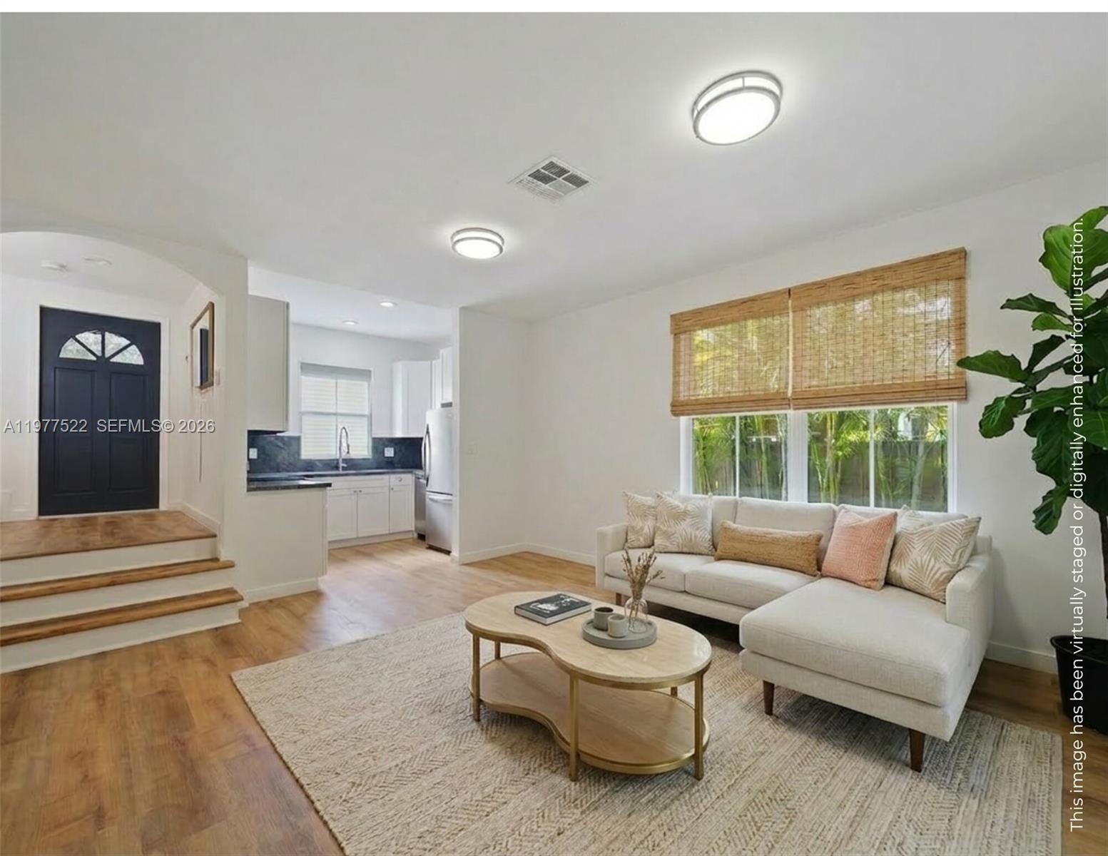 2976 Bird Avenue, Unit 18 Miami, FL 33133 - Photo 3 of 11 a living room with furniture and a large window