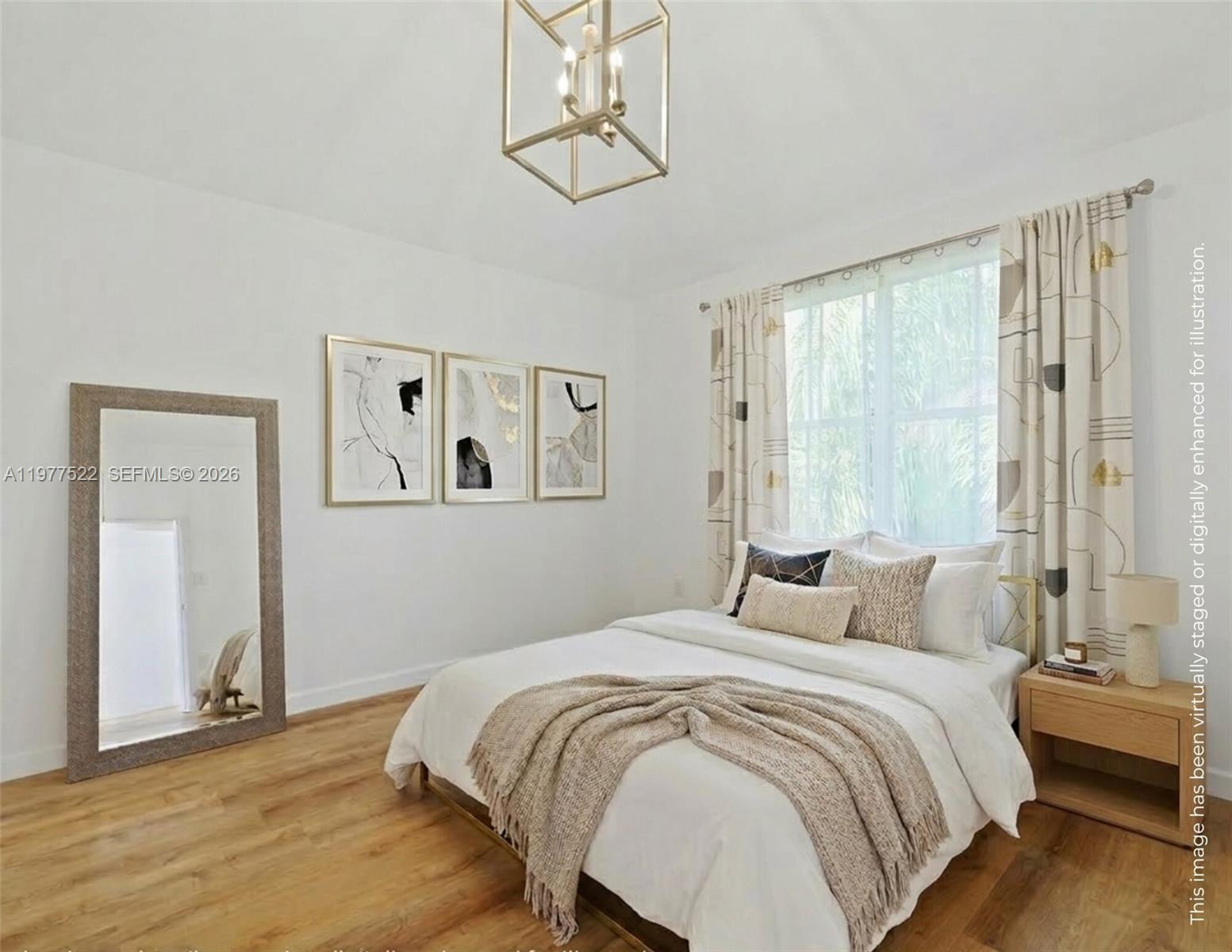 2976 Bird Avenue, Unit 18 Miami, FL 33133 - Photo 7 of 11 a bedroom with a large bed and a chandelier