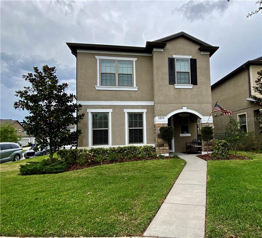 5819 Caldera Ridge Drive Lithia, FL 33547 - Photo 1 of 1 Front of house across the street from a park.