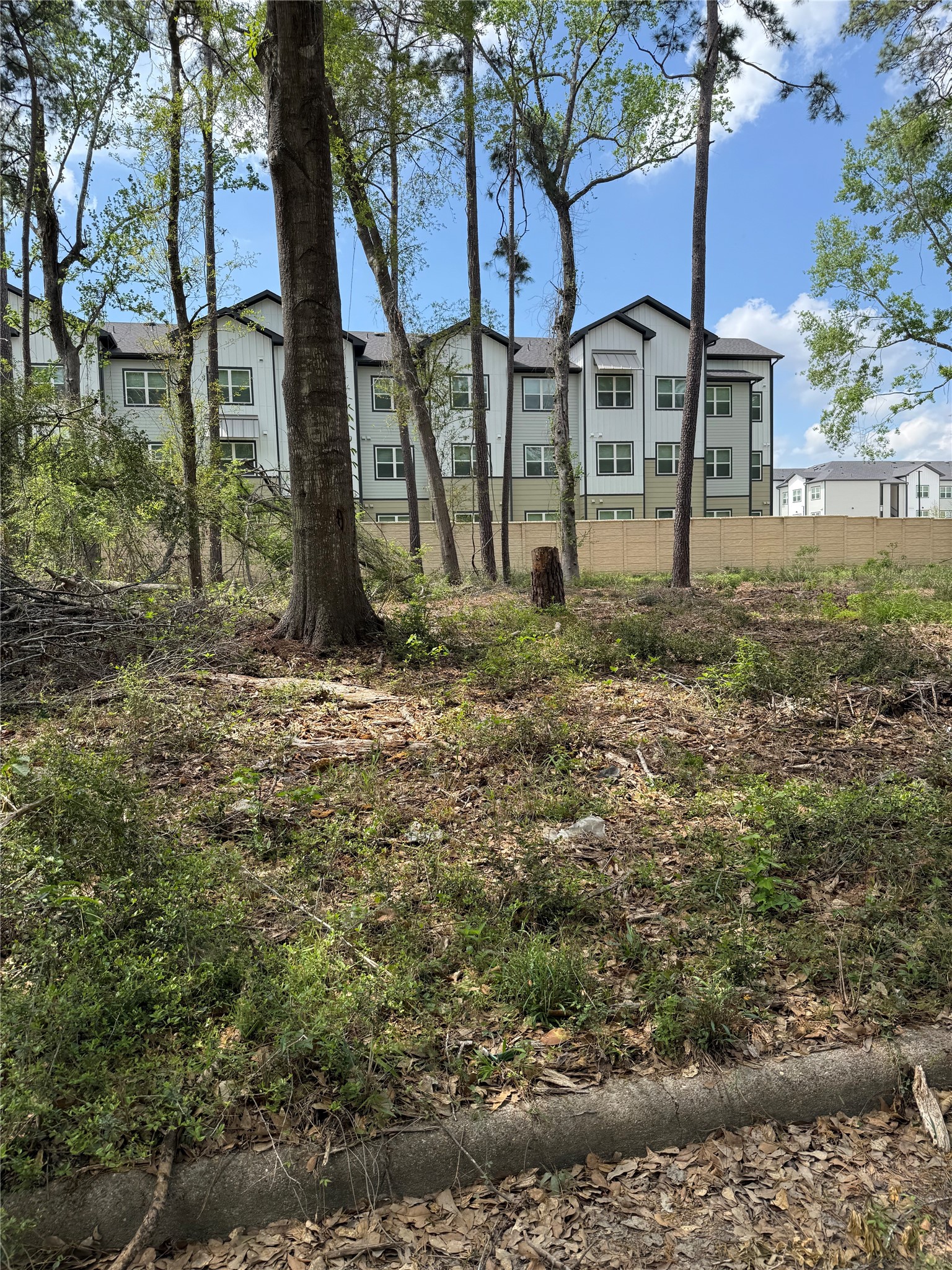 0 Sierra Lane Humble, TX 77346 - Photo 5 of 6 a view of a large house with a yard and large trees