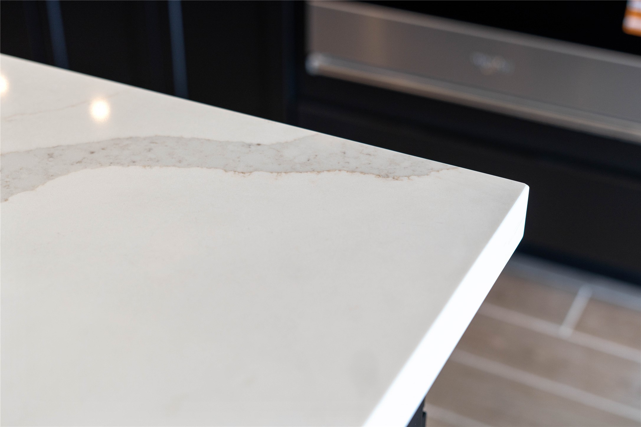 2114 Rowl Street Montgomery, TX 77316 - Photo 27 of 50 Stunning white quartz countertops with subtle marble veining, providing a sprawling, low-maintenance surface for meal prep and entertaining.