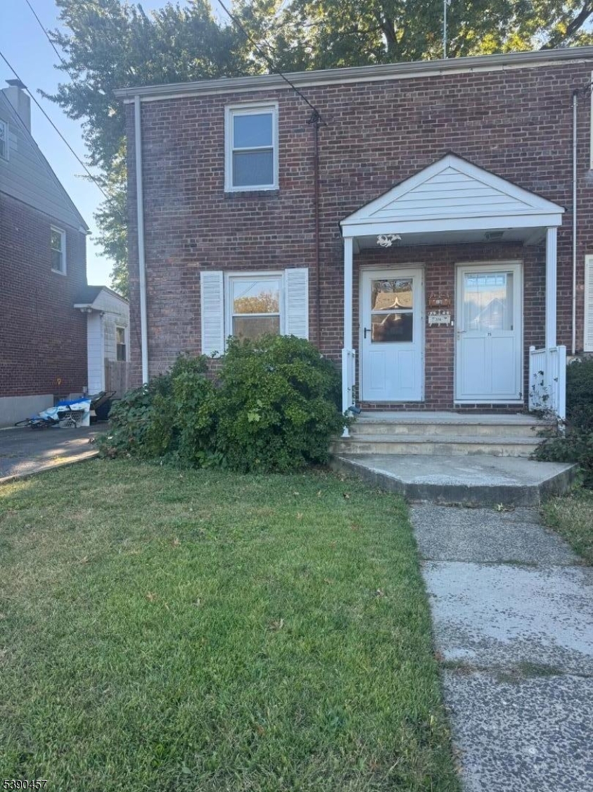 374 Raleigh Road Rahway, NJ 07065 - Photo 2 of 11 a front view of a house with garden