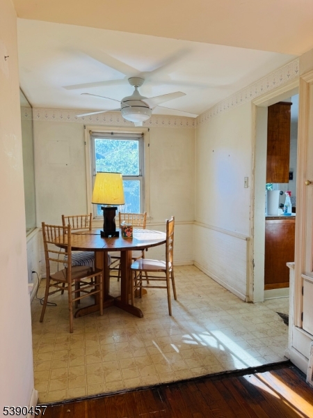 374 Raleigh Road Rahway, NJ 07065 - Photo 6 of 11 a view of a dining room with furniture and a window