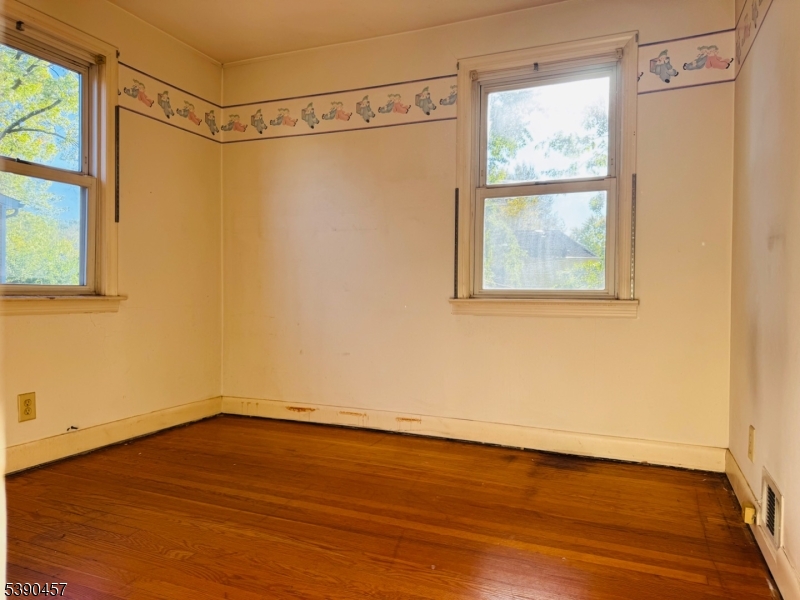 374 Raleigh Road Rahway, NJ 07065 - Photo 9 of 11 a view of a room with wooden floor and front door