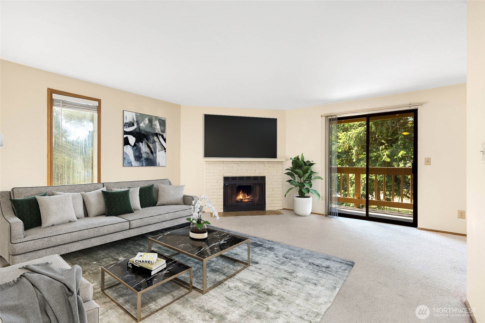 a living room with furniture a window and a fireplace