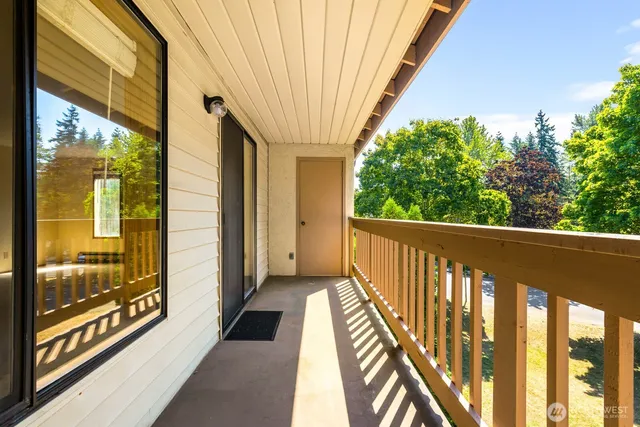 a view of balcony with wooden floor