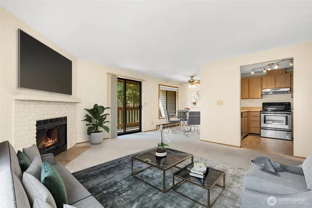 a living room with furniture fireplace and flat screen tv