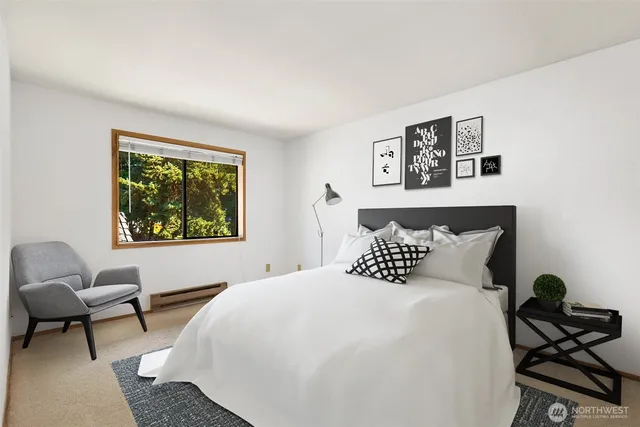 a bedroom with a bed and a chair