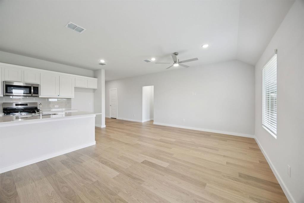 1144 Del Rio Drive Lavon, TX 75166 - Photo 9 of 27 Living Room in the Hadley home plan by Trophy Signature Homes – REPRESENTATIVE PHOTO