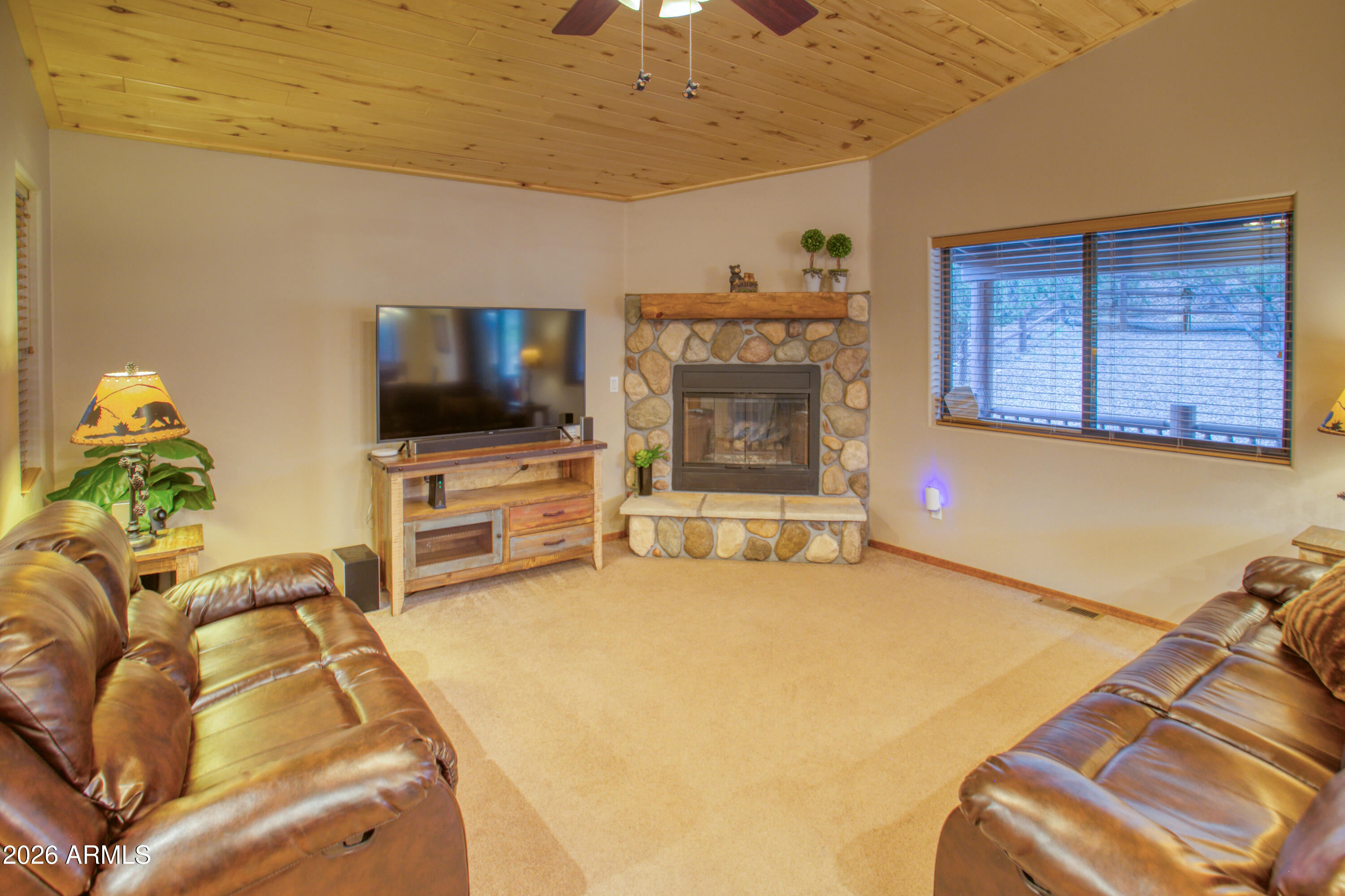 4840 West Cottage Loop Show Low, AZ 85901 - Photo 13 of 47 a living room with furniture and a flat screen tv