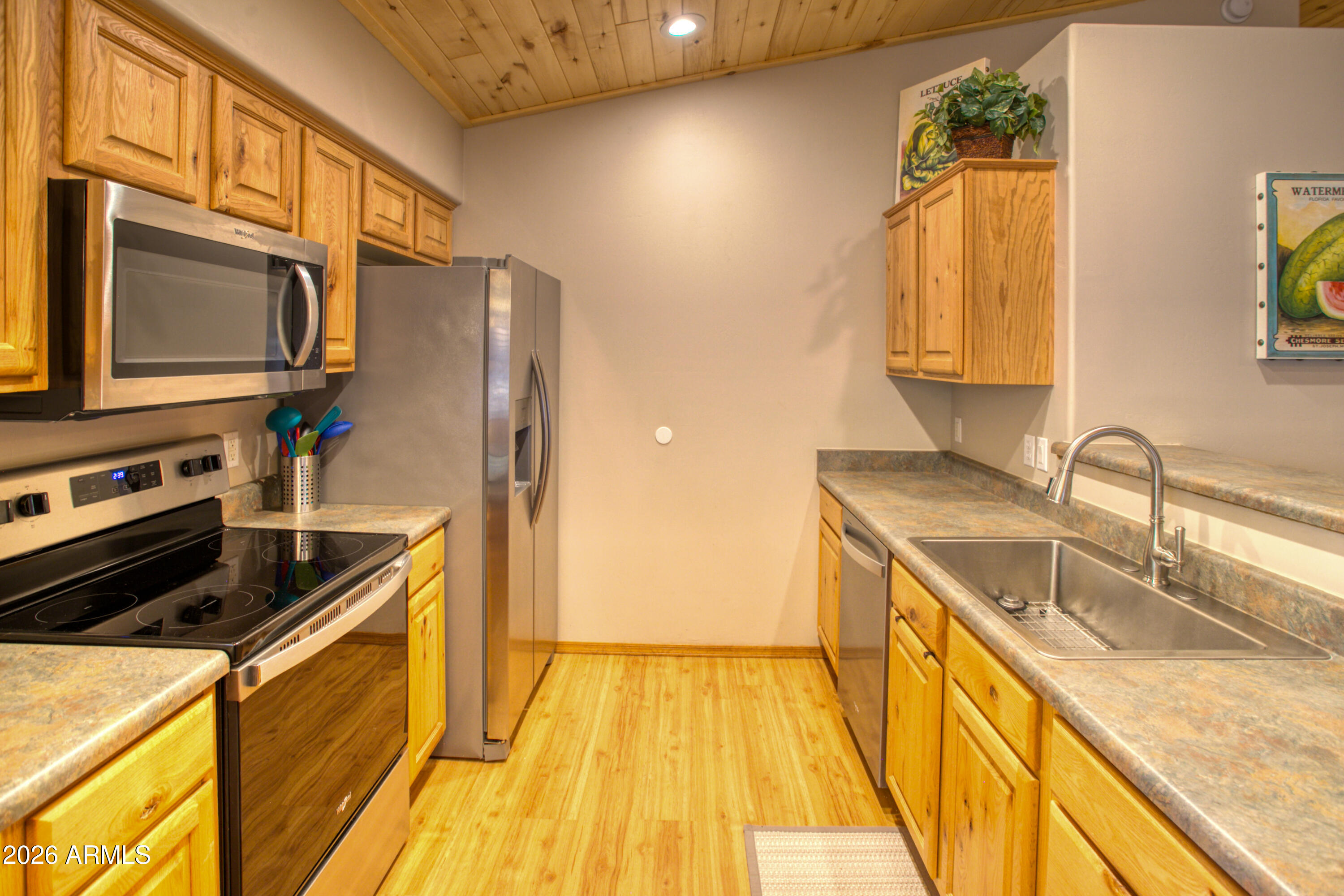 4840 West Cottage Loop Show Low, AZ 85901 - Photo 16 of 47 a kitchen with stainless steel appliances granite countertop a sink a stove and a refrigerator