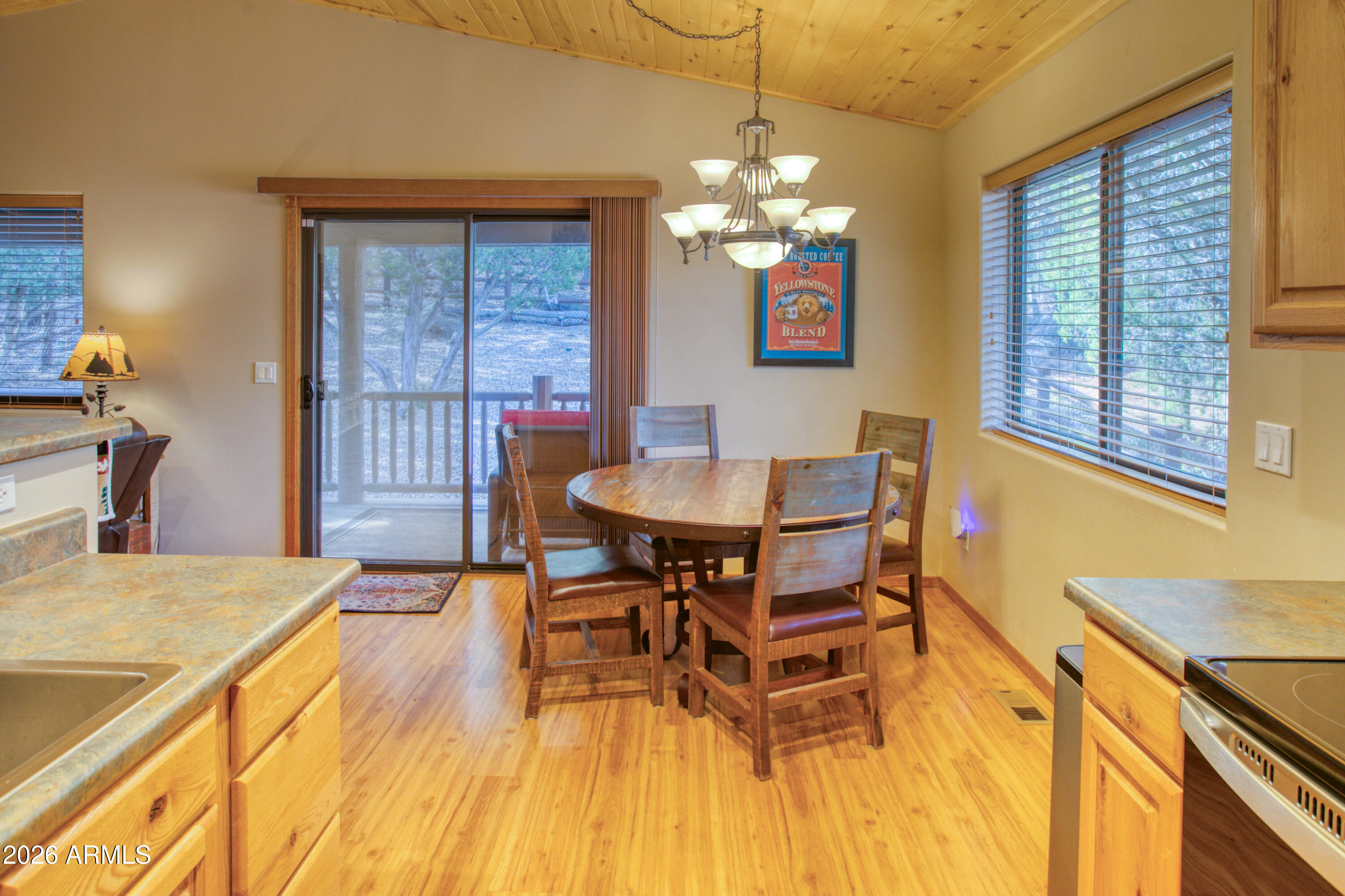 4840 West Cottage Loop Show Low, AZ 85901 - Photo 18 of 47 a view of a dining room with furniture and chandelier