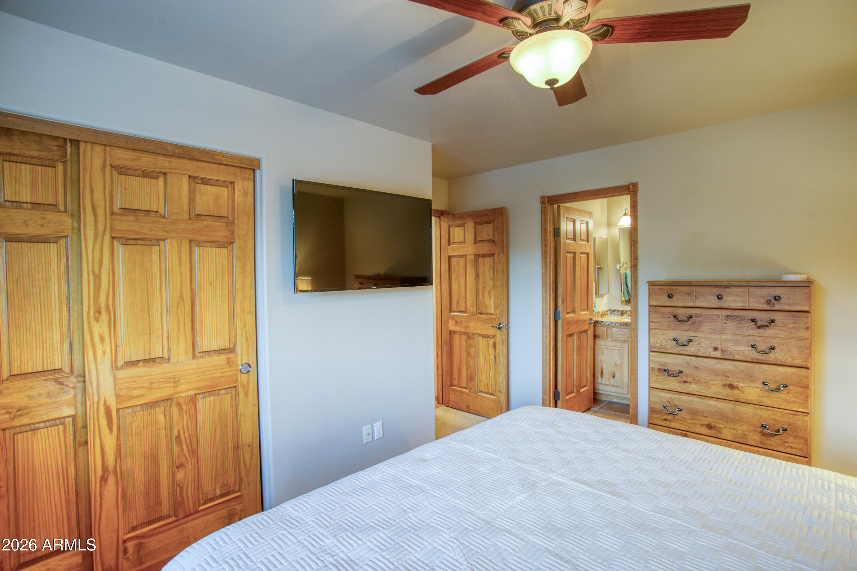 4840 West Cottage Loop Show Low, AZ 85901 - Photo 20 of 47 a view of a bedroom with closet and cabinet