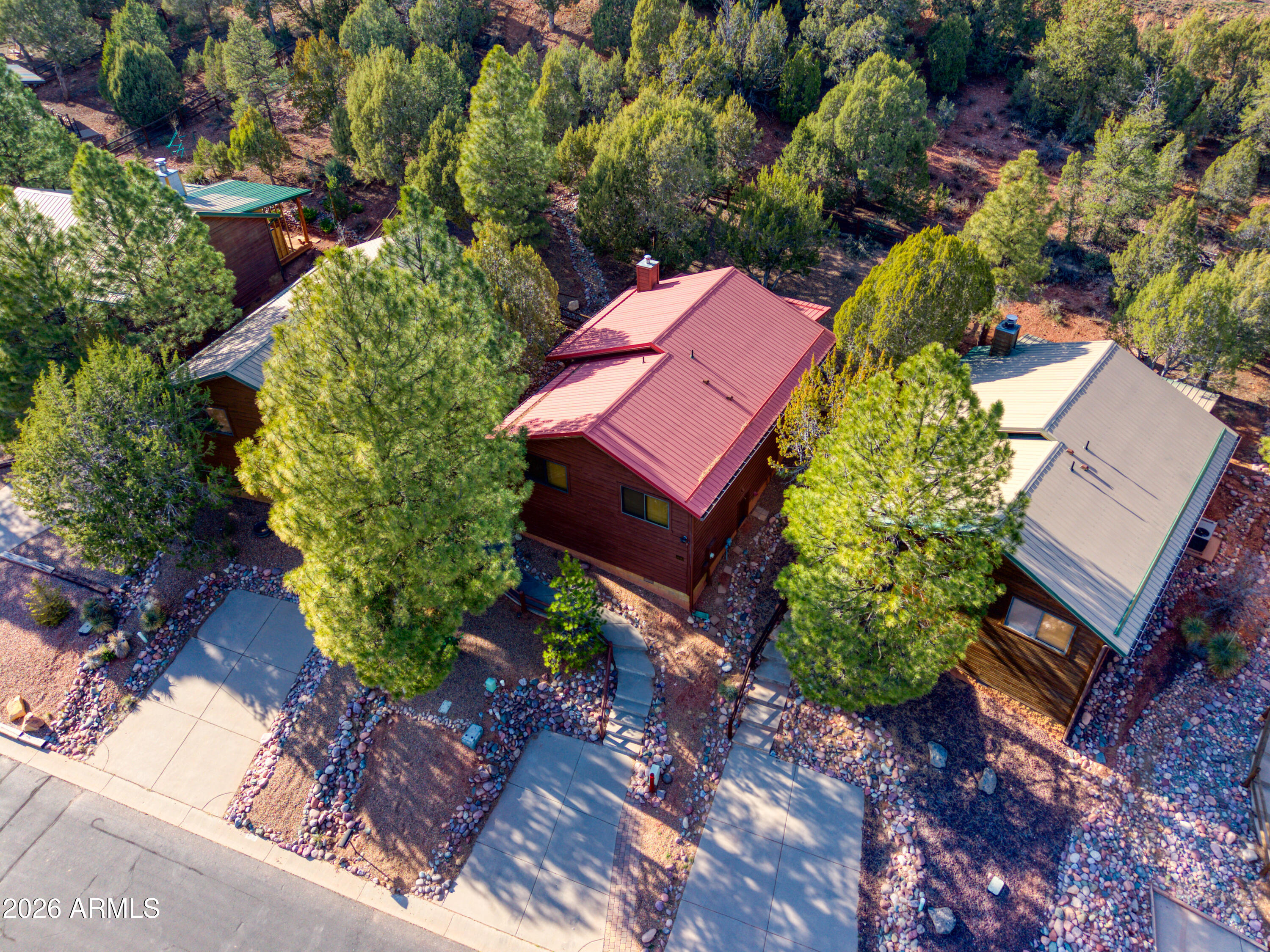 4840 West Cottage Loop Show Low, AZ 85901 - Photo 2 of 47 an aerial view of a house with a yard and garden