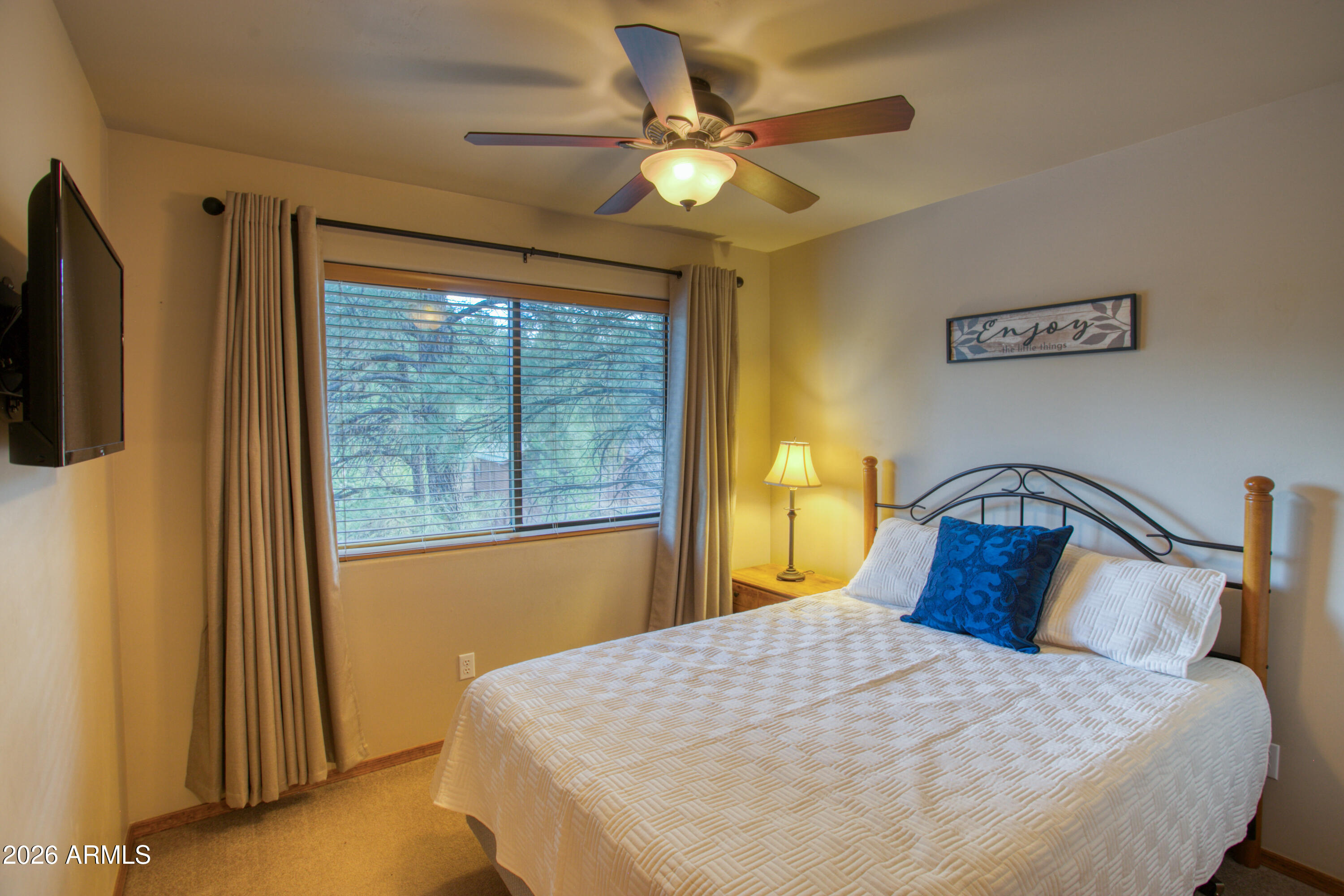 4840 West Cottage Loop Show Low, AZ 85901 - Photo 22 of 47 a bedroom with a bed and a window