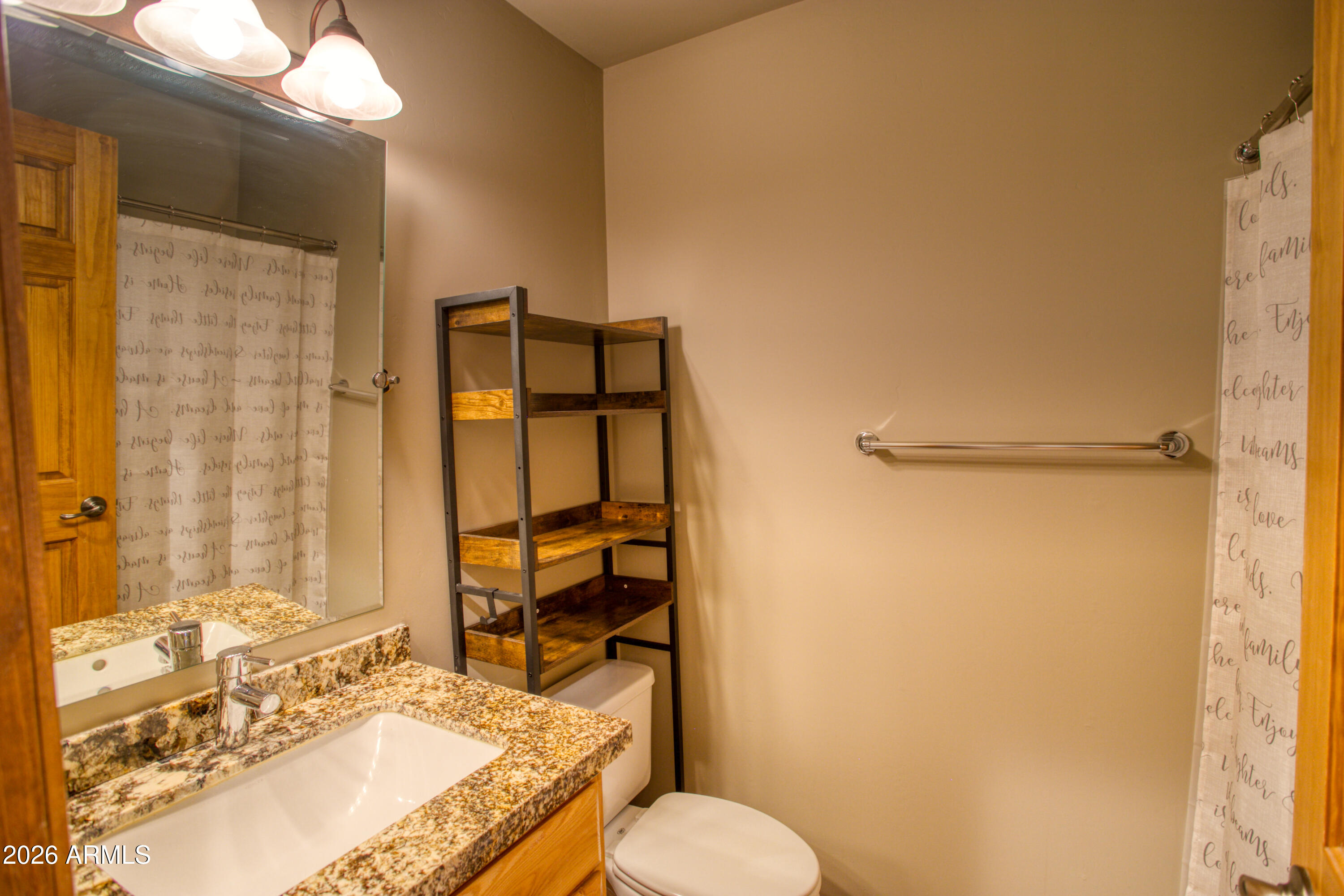 4840 West Cottage Loop Show Low, AZ 85901 - Photo 24 of 47 a bathroom with a granite countertop sink toilet and shower